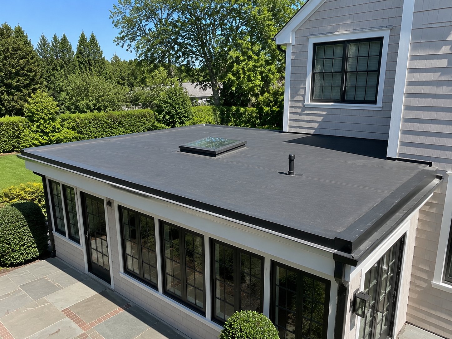 Finished EPDM flat roof with skylight over a sunroom, Suffolk County